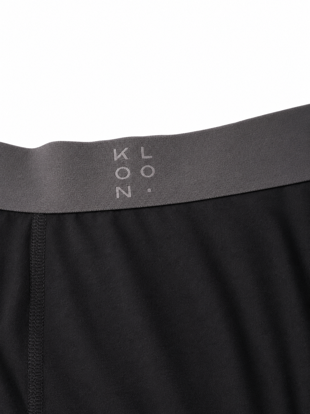 KLOON-logo pa borstet linning, naerbilde
